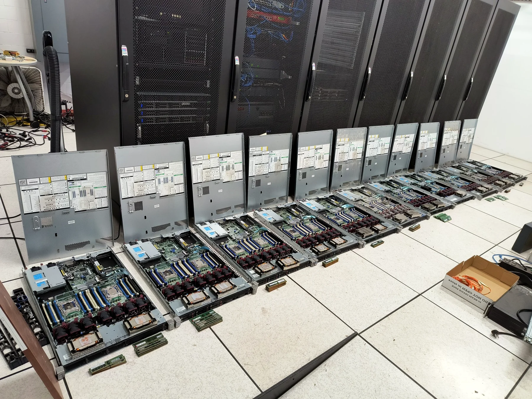 A row of open enterprise servers being prepared and maintained